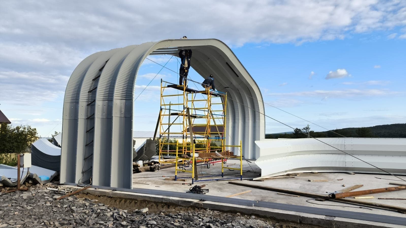 Commercial steel aviation facility with engineered facade and entry canopy